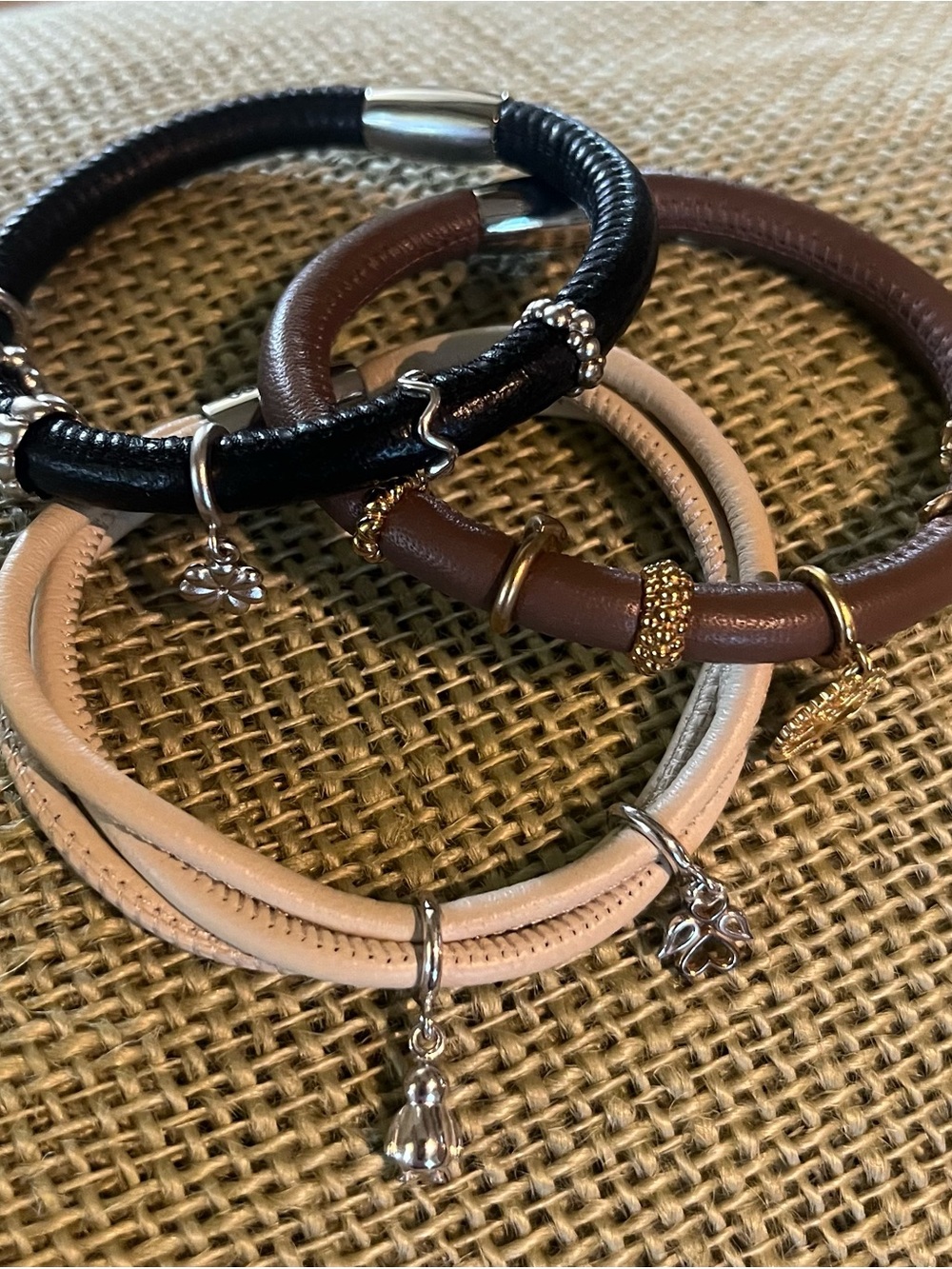 3- leather endless bracelets w/ gold and silver charms